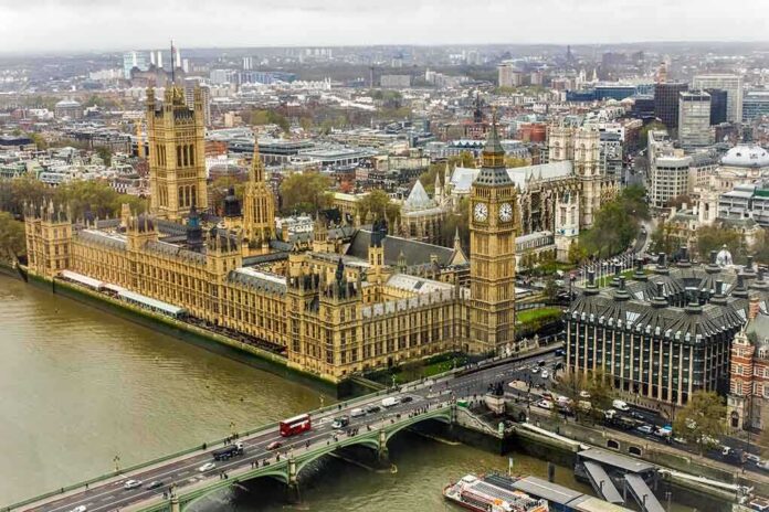 Aerial view of the Houses of Parliament and Big Ben in London, with the Thames River and cityscape