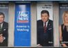 Tucker Carlson and Bret Baier on large Fox News promotional posters