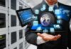 Businessperson holding a digital tablet with floating data icons