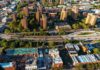Aerial view of city high-rise apartments and highway