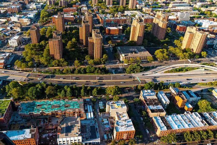 Aerial view of city high-rise apartments and highway