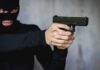 Terror Siege: Nairobi Attack Lasted 19 Hours Person in balaclava aiming a handgun