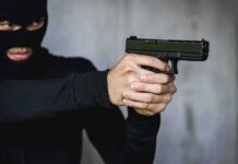 Terror Siege: Nairobi Attack Lasted 19 Hours Person in balaclava aiming a handgun
