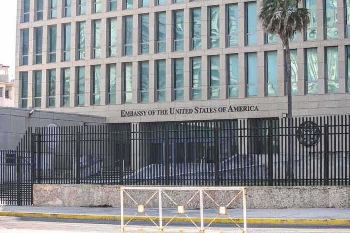 Embassy building behind tall black security fence