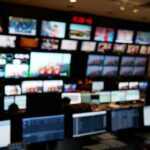 control room with multiple screens and monitors