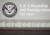 22 States Challenge New Green Card Rule USCIS building sign with DHS seal