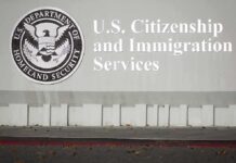 22 States Challenge New Green Card Rule USCIS building sign with DHS seal