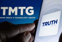 Trump Revives Feud With CNN Smartphone showing Truth Social app icon beside TMTG logo on screen