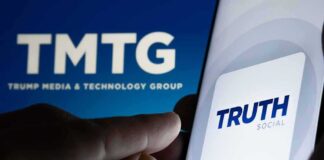 Smartphone showing Truth Social app icon beside TMTG logo on screen