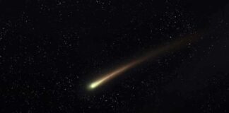 Comet streaking across a starry night sky