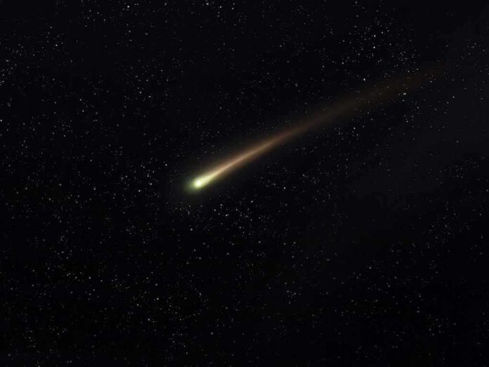 shutterstock_2090842810 Comet streaking across a starry night sky