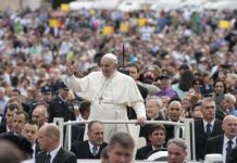 Pope Leo XIV Draws Huge Paris Crowd Francis waves from a vehicle amid a large crowd; Keith Allen and Andreas Hestler are also present