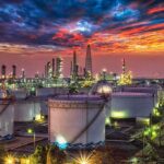 China’s Russian Oil Premiums Hit Record Highs Oil refinery with storage tanks at sunset