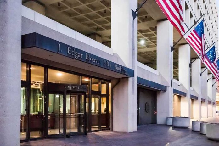 shutterstock_561918766 J. Edgar Hoover FBI Building entrance with American flags