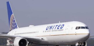 United Airlines jet taxiing on runway