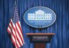 Energy Truce Announced, but Where’s the Proof? White House press briefing podium and US flag