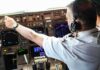 Alleged Al-Qaeda Posts Surface After Cockpit Attack Pilot adjusting controls in an airplane cockpit