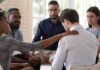 support group comforting a man