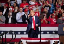 Trump Promotes Alaska’s Massive Gas Project Donald Trump points from a rally stage; Rudi Koertzen and Bear Pascoe are in the crowd