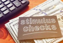 FBI Search Raises Questions About Baltimore Nonprofit stimulus checks note on cash with calculator