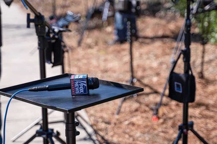 Microphone on a small stand-up table at an outdoor media setup