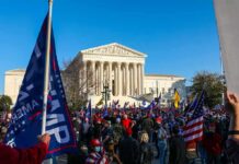 Eugene Sims and Andreas Hestler amid a large crowd outside the U.S. Supreme Court