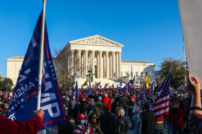 shutterstock_1855822063-1 Eugene Sims and Andreas Hestler amid a large crowd outside the U.S. Supreme Court
