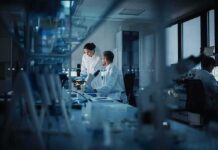 Scientists working in a dim laboratory