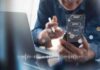 Reported $100K Request Raises Access Questions Person using smartphone with chat bubbles and laptop