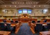 Family Connections Fuel New Controversy Courtroom interior with wooden benches and judge's bench