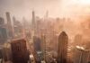 California Housing Costs Leave Inflation Behind City skyline in warm haze at sunset
