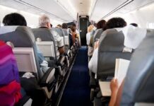 Flydubai Flight Diverts After Cockpit Attack Airplane cabin with passengers seated in rows